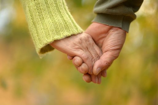 Elderly couple Holding Hands 