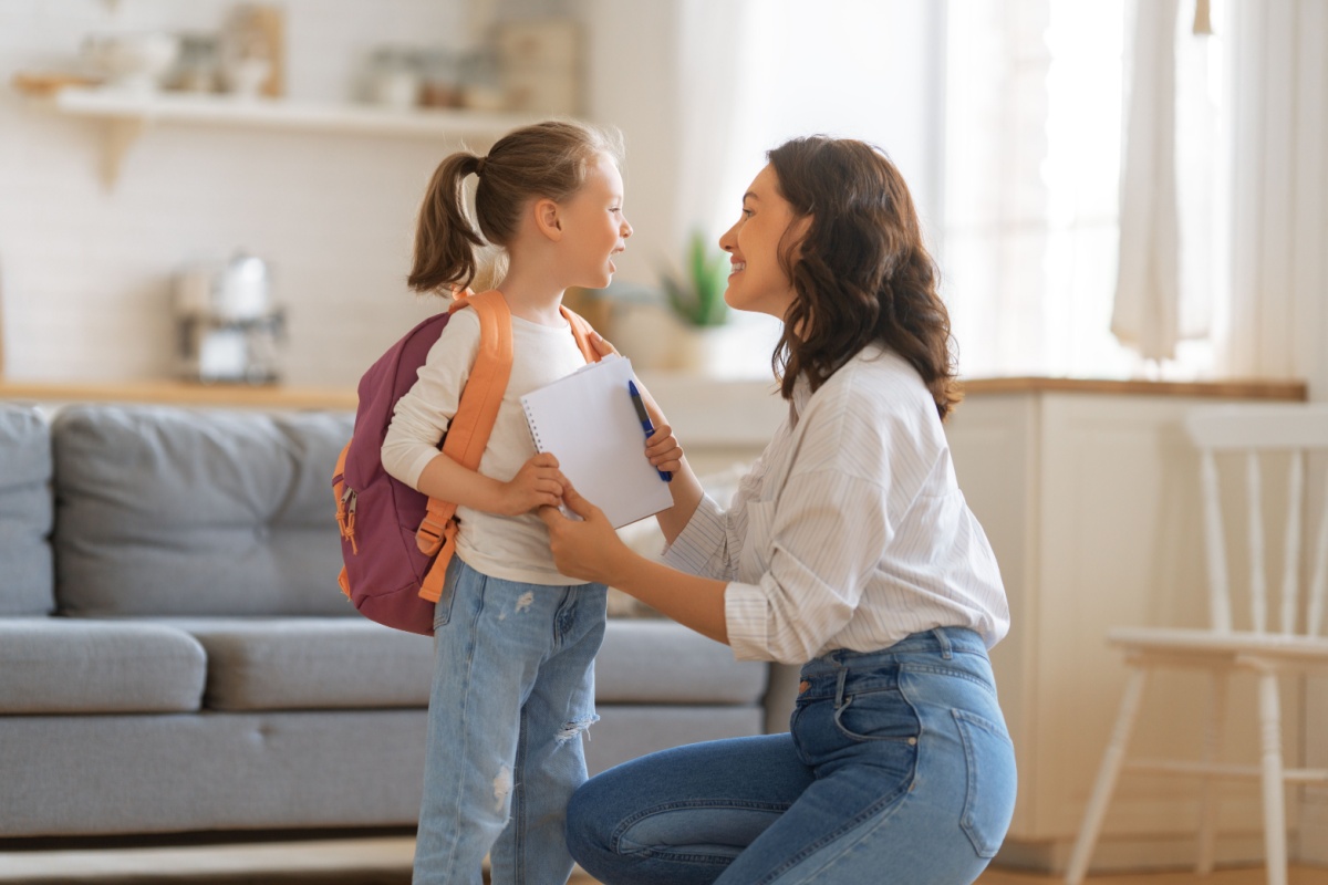 Mother and daughter preparing for school
