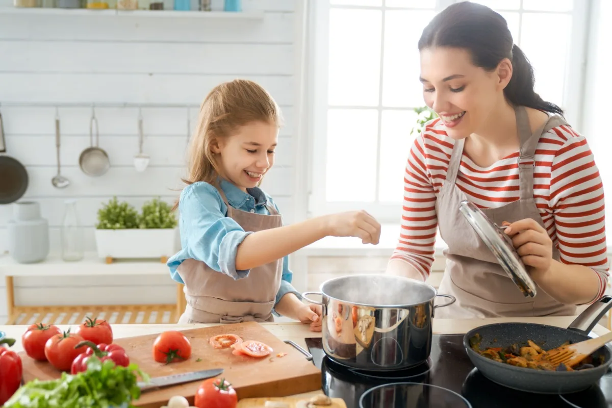 Mother and child cooking in the kitchen