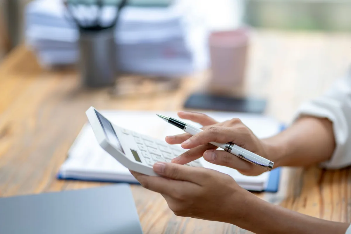 Woman using a calculator