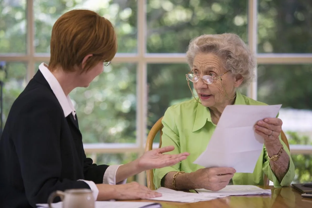 Senior woman talking to a financial planner