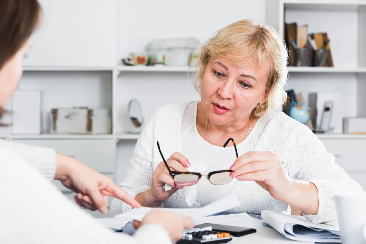 Female financial adviser helping a mature woman review her finances