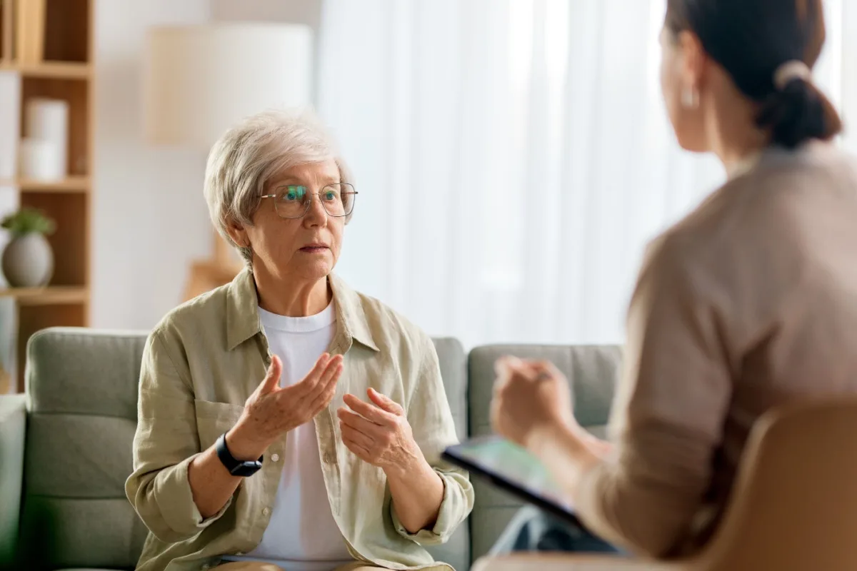 senior woman speaking to her financial planner