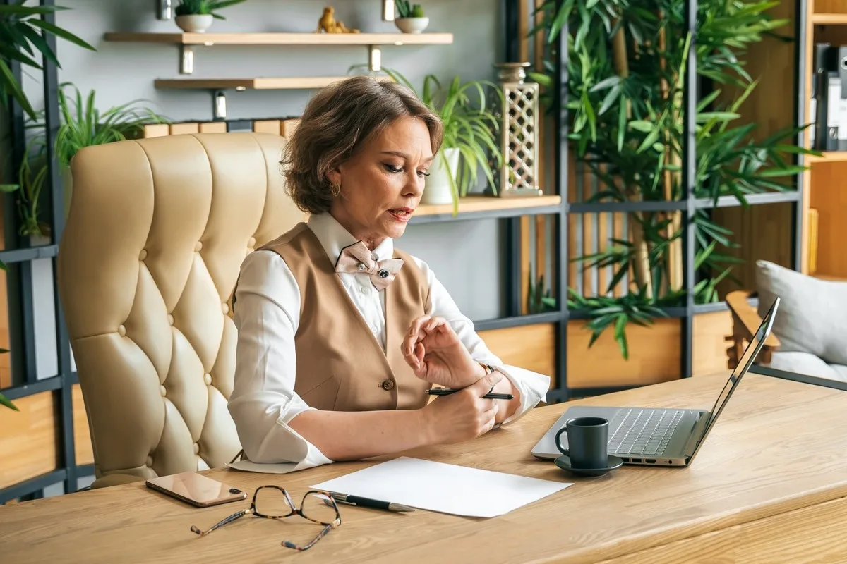 A professional woman working at her desk